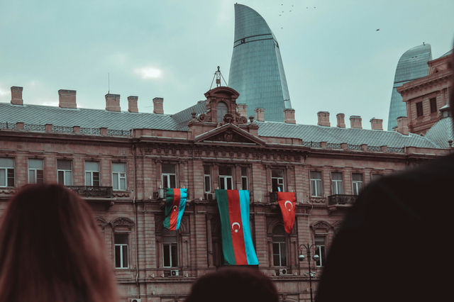 a group of people standing in front of a building