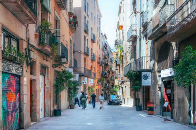Explore the vibrant life in Barcelona's Gothic Quarter with its iconic narrow streets.