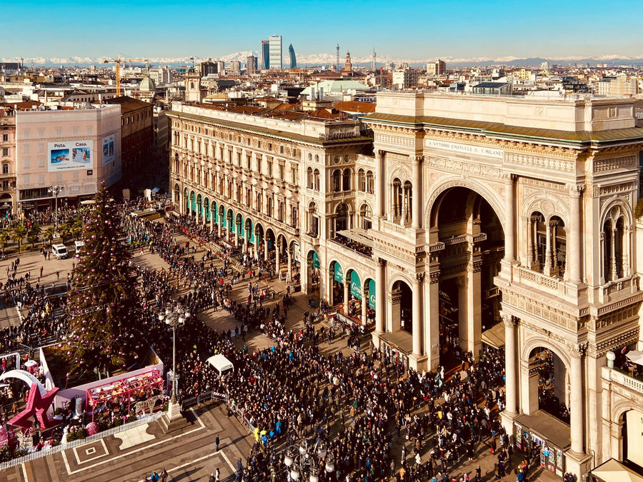 A bustling scene at Galleria Vittorio Emanuele II in Milan during the holiday season.