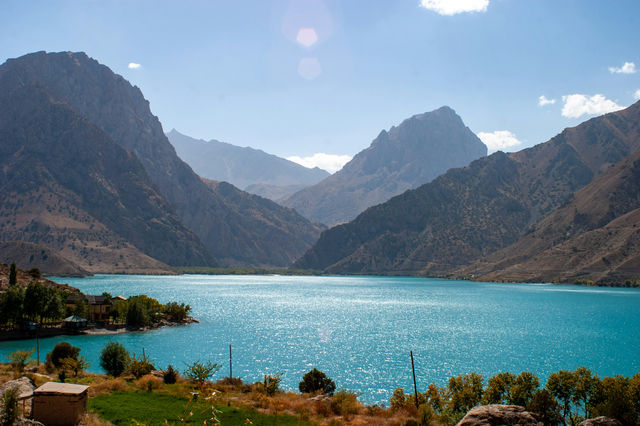 A large body of water surrounded by mountains