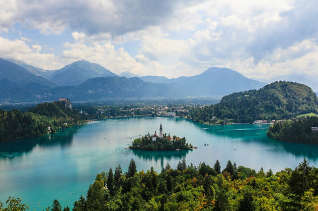 Lake Bled with its island church surrounded by mountains in Slovenia.