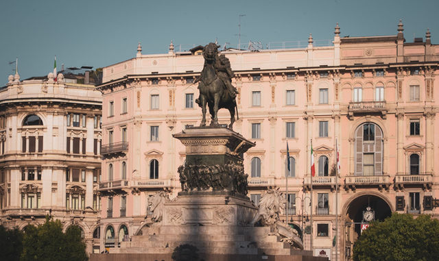 View of the iconic Piazza del Duomo with the equestrian statue in Milan, Italy.