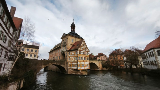 Capture of the historic Old Town Hall in Bamberg, Germany with river view.