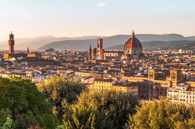Breathtaking sunset over Florence, showcasing the Duomo and Tuscan landscape.