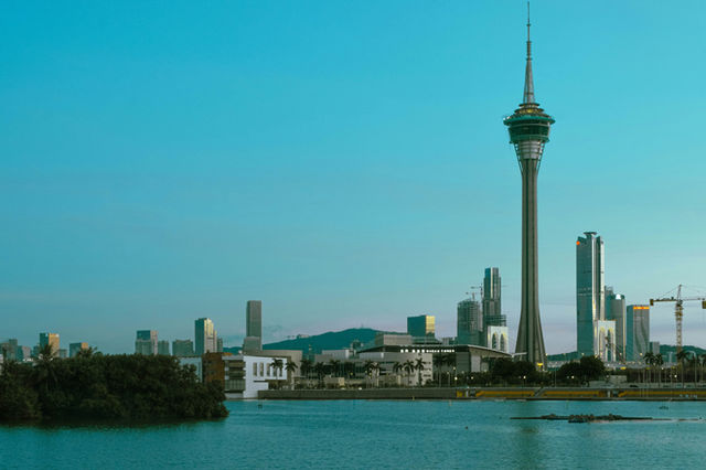 A large body of water with a city in the background