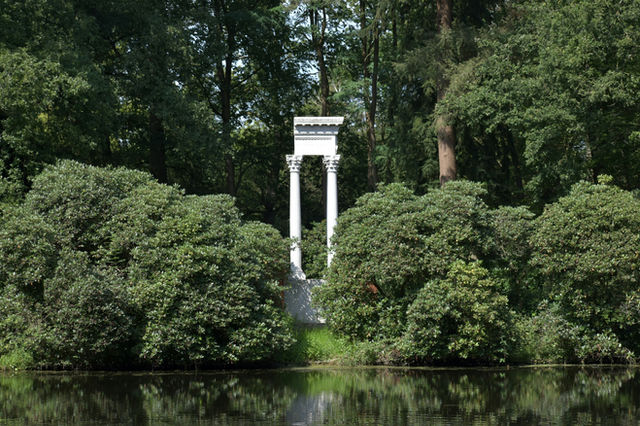 White greek pillars in a garden (Garden architecture - silence)