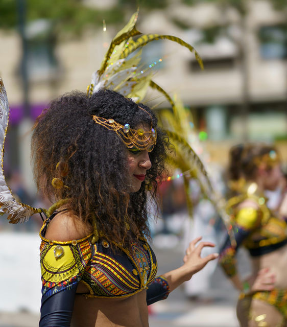A troupe walking the route together — the Paris tropical carnival