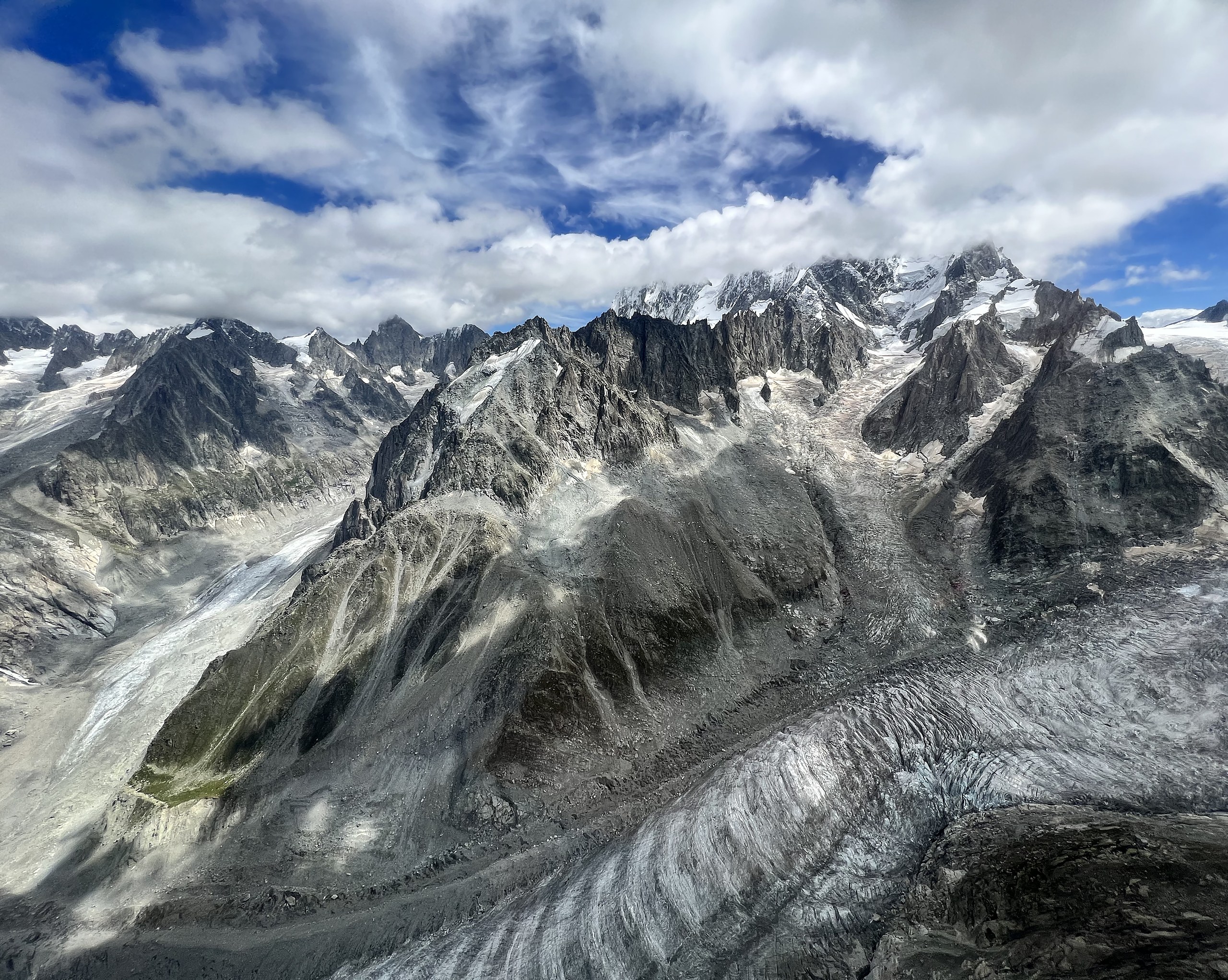 The Argentiere glacier winding beneath the Aiguilles above Chamonix, seen from the air