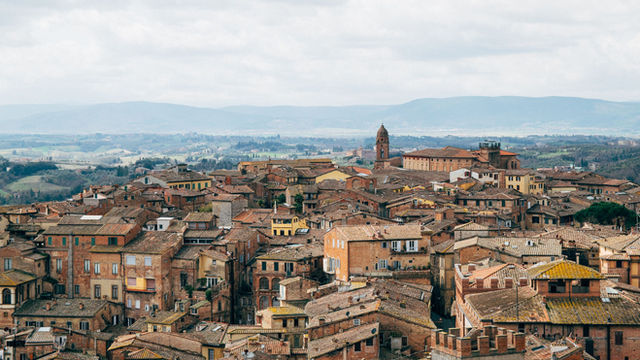 Discover the rustic charm and stunning rooftops of Asciano, Tuscany, Italy.