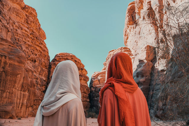 a couple of women standing next to each other