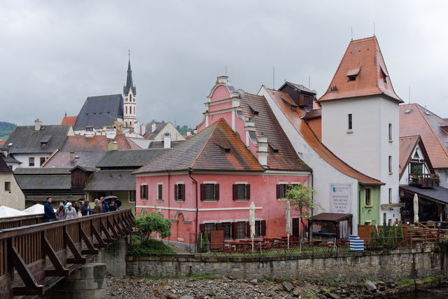 Old Town in Český Krumlov with the Church of St. Vitus and the Deer Footbridge over the Vltava River