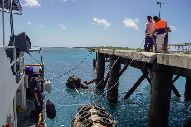 The Coast Guard Cutter Oliver Berry crew conducts a potable water offload while moored up at Kiritmati Island, Kiribati, July 8, 2022. The U.S. Coast Guard provided humanitarian as