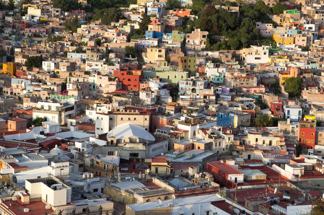 Colorful rooftops and buildings form a stunning aerial view of downtown Guanajuato.