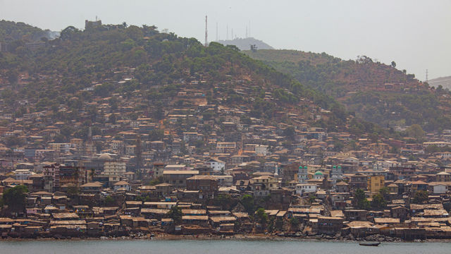 city buildings near body of water during daytime