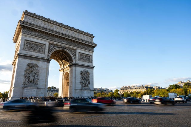 The arc de triomphe in paris with traffic
