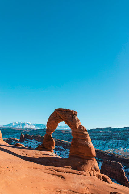 a large rock formation in the middle of a desert
