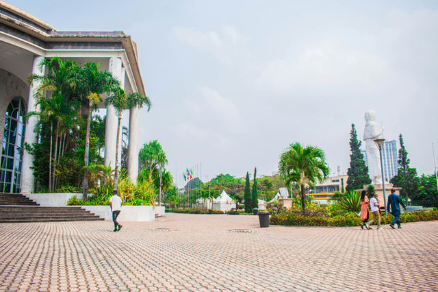 A group of people walking around a courtyard