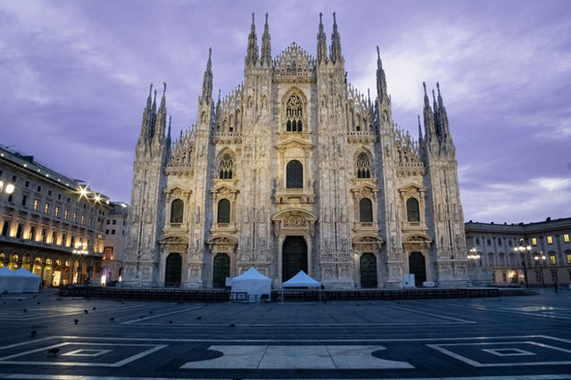 The majestic Milan Cathedral captured at dawn, showcasing its Gothic architecture in Italy's Lombardy region.