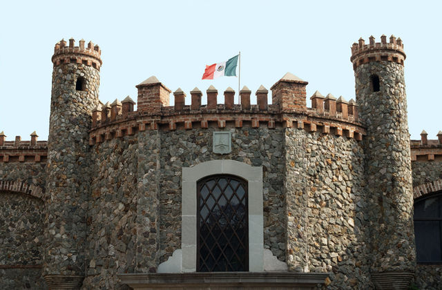 A castle with a flag on top of it
