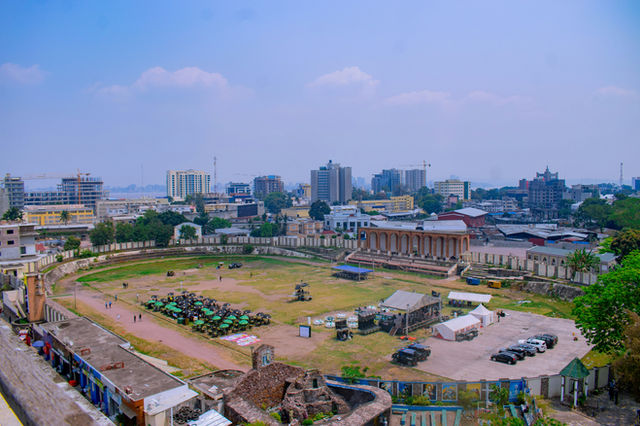 Urban cityscape with stadium and buildings under-construction buildings.