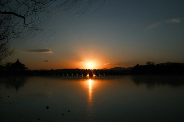 Sunset over a bridge and calm water