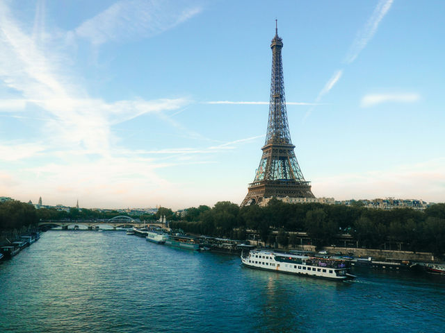 This image focuses on the architectural brilliance of the Eiffel Tower, highlighting iron patterns, structural symmetry, and industrial elegance. The perspective emphasizes geometry, repetition, textu