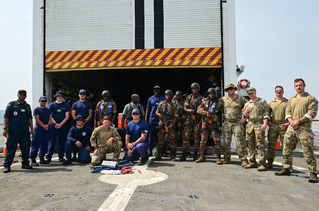 Coast Guardsmen and members of the Benin Navy pose for a photograph after conducting law enforcement training aboard USCGC Spencer (WMEC 905) as part of Obangame Express 23 in the