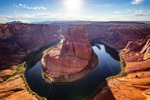 A large body of water surrounded by mountains
