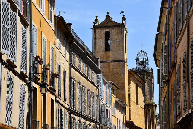 Picturesque architecture of Aix-en-Provence's historic streets on a sunny day.
