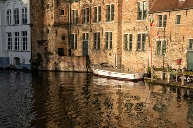 A row of buildings next to a body of water