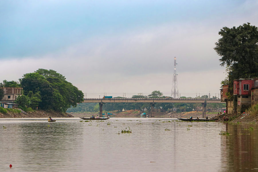 a bridge over a body of water with boats in it