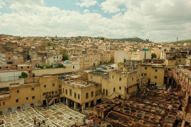 Explore the historic views of Fes Medina with its iconic tanneries and traditional architecture.