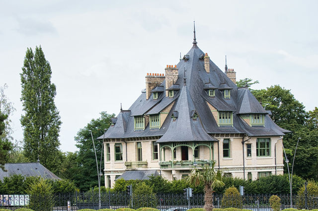 A large white house with a black roof