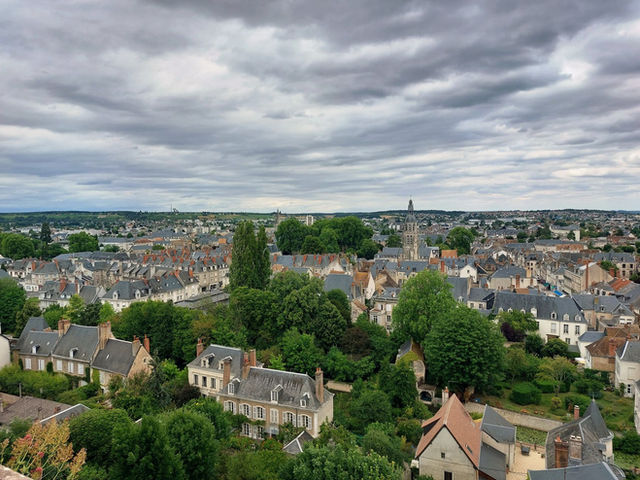 A picturesque aerial view of Vendôme, showcasing historic architecture and lush greenery.