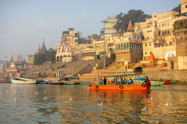 a group of boats floating on top of a river