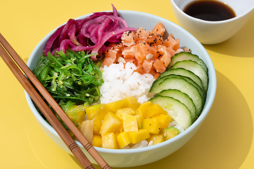 poke-bowl-with-rice-salmoncucumbermangoonionwakame-salad-poppy-seeds-ands-sunflowers-seeds