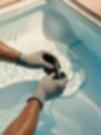 please make an aestethic light image show a person repairing a pool show only his hands wi