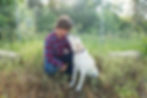 senior photographer captures senior pictures of a senior boy in a flannel shirt with his yellow lab