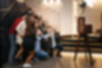 People posing in front of a photobooth at a company event