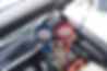 pressure-gauge-is-hanged-on-the-hood-over-the-engi-2026-03-24-21-52-35-utc.jpg