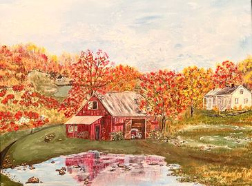 New England barn in the autumn.  Pond in front of barn casting shadow int he water.