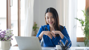 A woman working from home as a virtual assistant