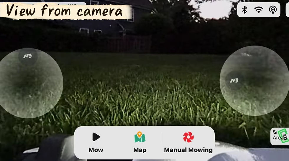This the camera view from a Robotic Lawn Mower in the dark using the headlight