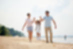 Carefree-family-enjoying-vacation-384325.jpg