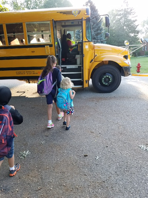 First day! Bus stairs are bigger than her!