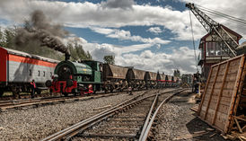 As part of the 60th Anniversary Gala at the Chasewater Railway, there was a full week of events and special workings along the 4 mile preserved line, including a multitude of freight workings.
Here, Bagnall 0-4-0 "Dunlop No.6" departs Brownhills West with an MGR train for Chasetown (Church Street).