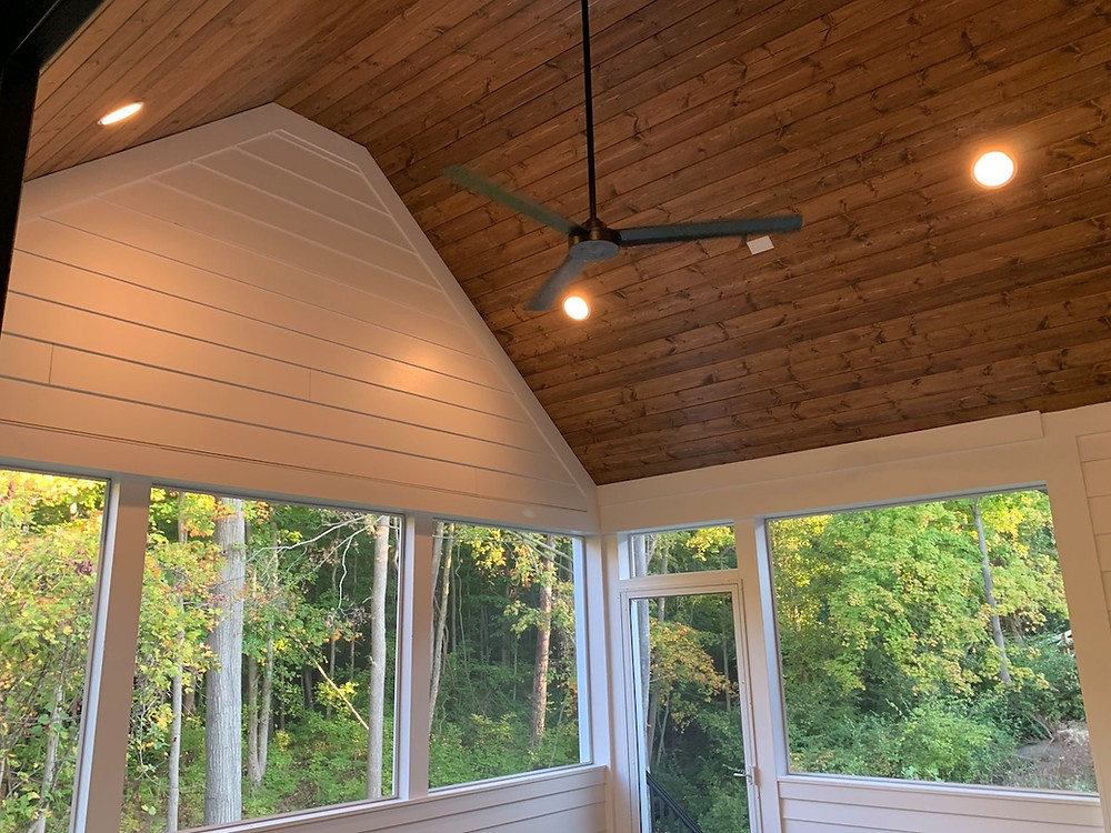Covered patio with stained pine ceiling from a custom ranch home design in Cincinnati, Ohio