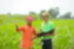 young-india-bank-officer-completing-paper-work-with-farmers-agriculture-field.webp