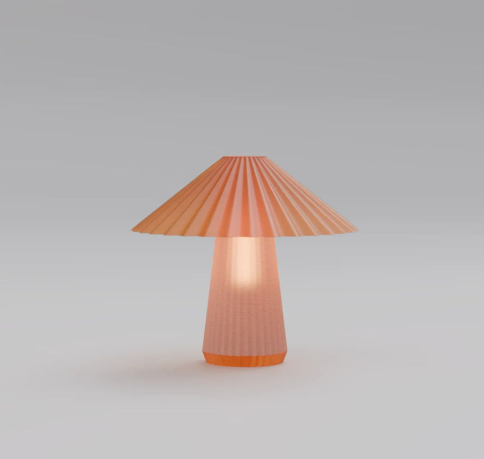 Orange lamp on a white background with a pleated lampshade design.