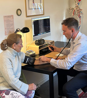 “Chiropractor taking vitals during physical examination”